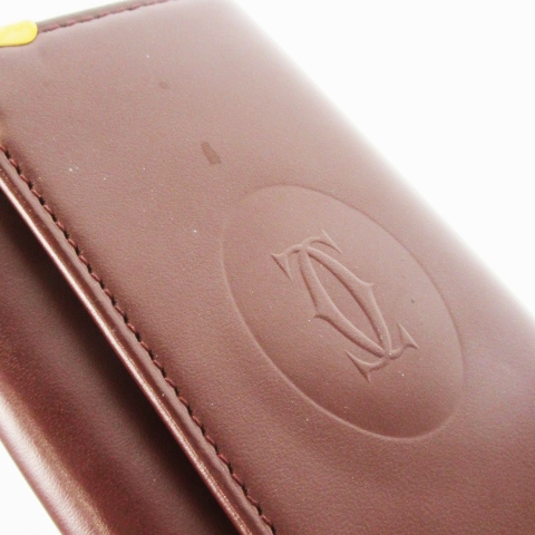 Cartierカルチェの キーケース　 赤茶、未使用品 カルティエ Cartier キーケース 3つ折り レザー 革 ロゴ型押し 4